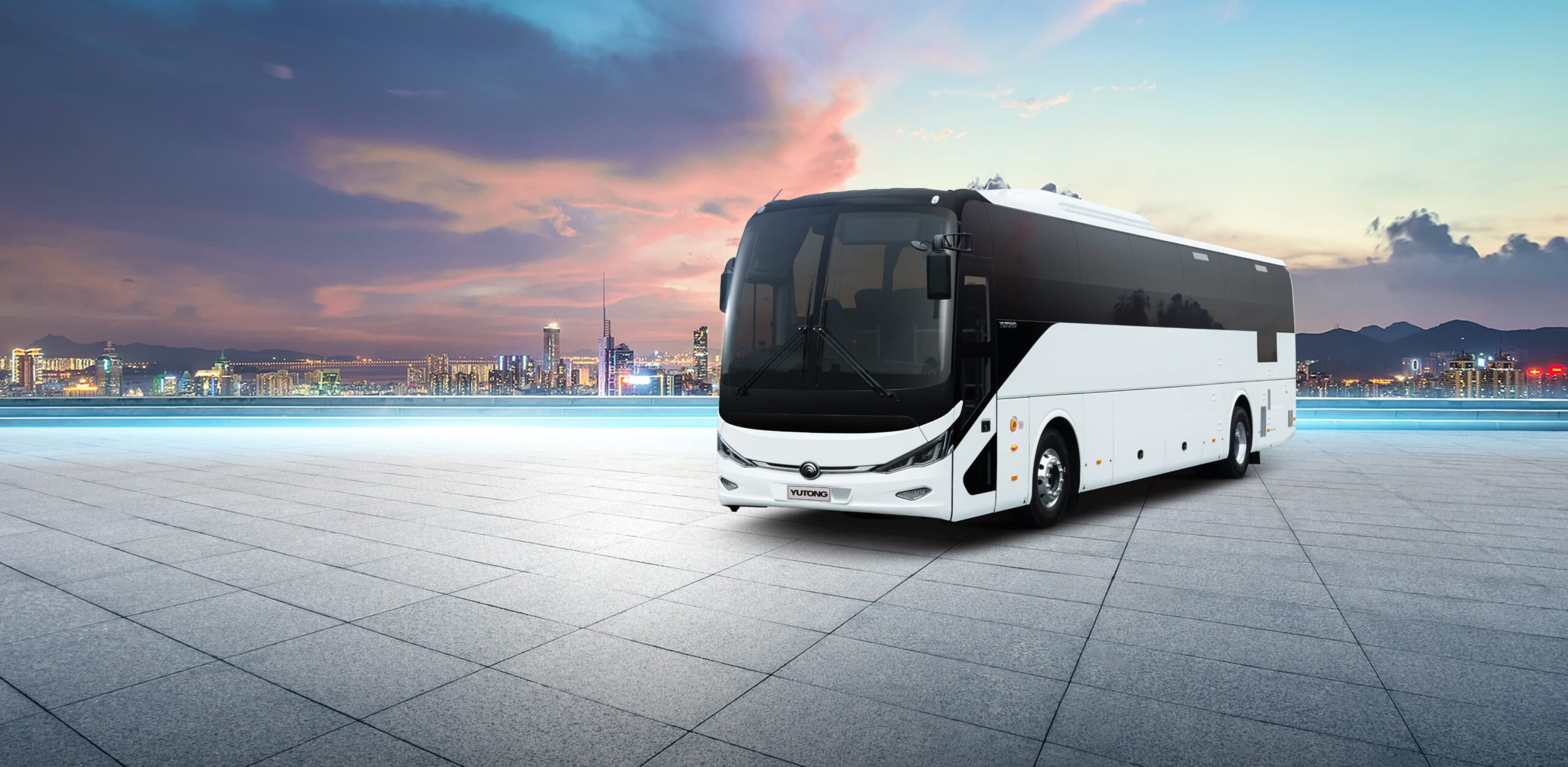 A modern bus parked in a picturesque location in Ajman, highlighting the convenience and luxury of bus rental services in the city.