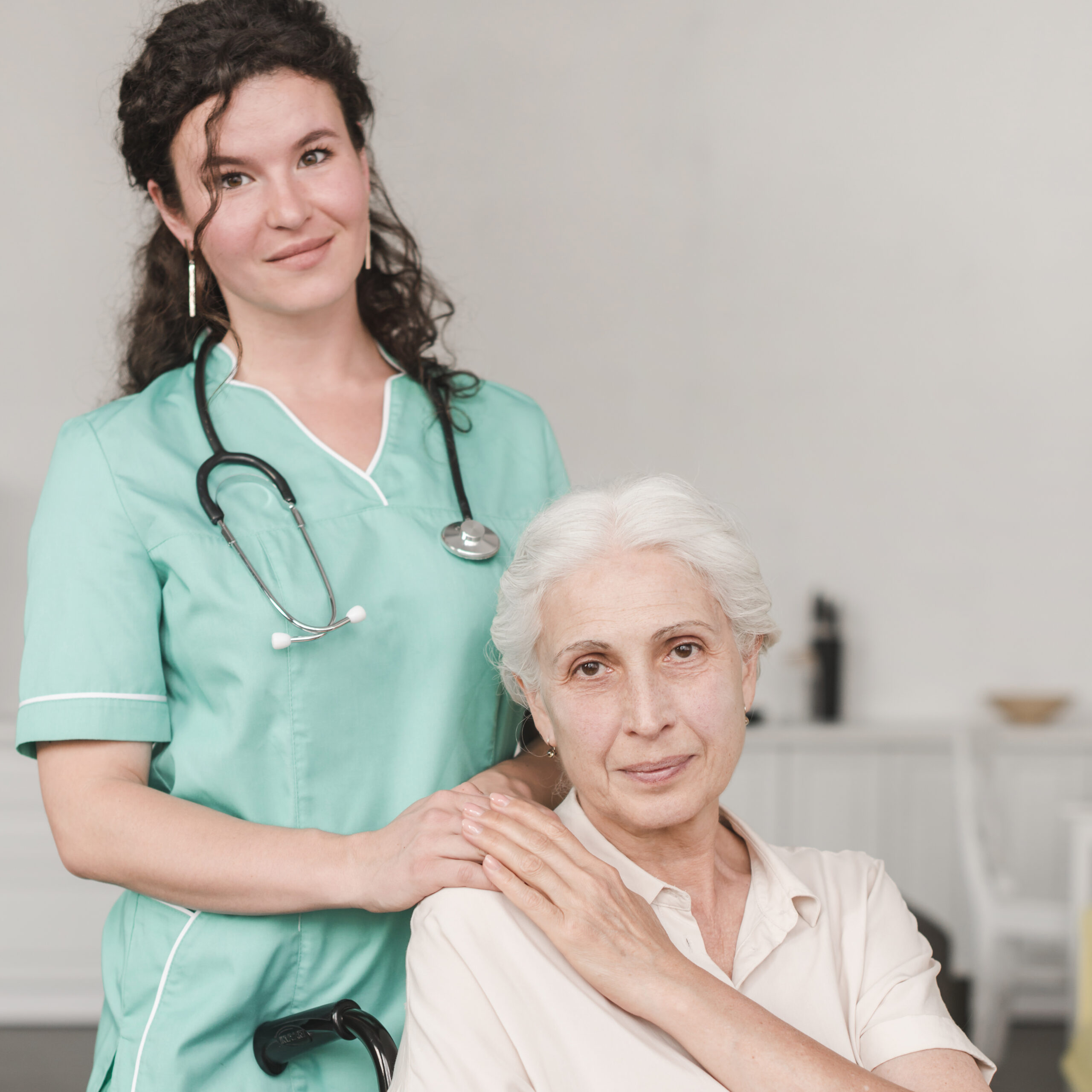 portrait-female-nurse-with-her-senior-patient-sitting-wheel-chair